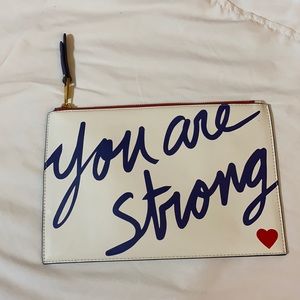 “You are Strong” clutch by Drew Barrymore